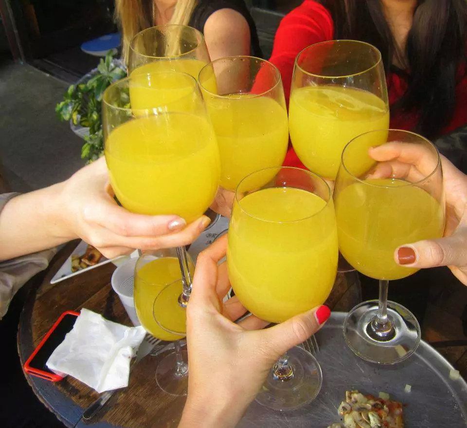 people having mimosas at a bar