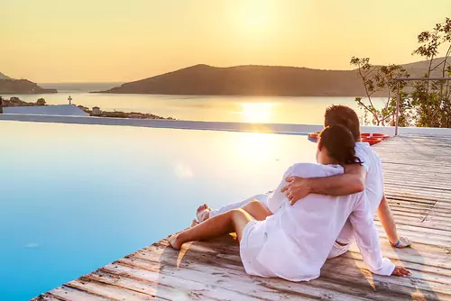 happy couple on the dock enjoying the outdoors together