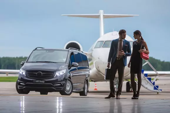 millionaire couple at a private airport