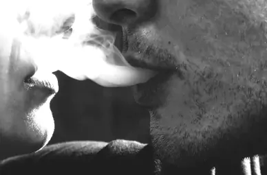 young couple smoking cannabis