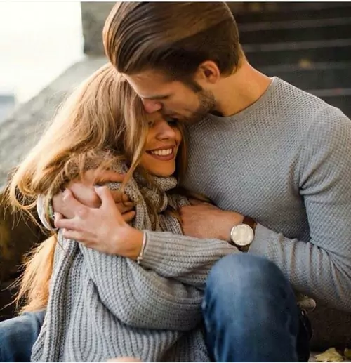 Young couple smiling and embracing each other