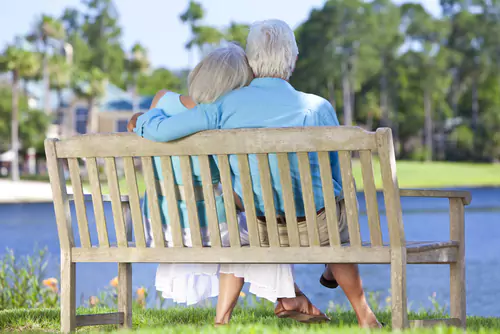 Senior dating couple on bench
